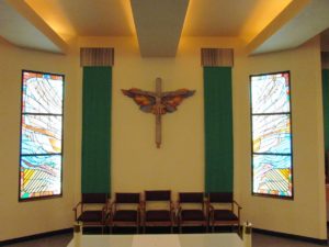 crucifix and stained glass windows